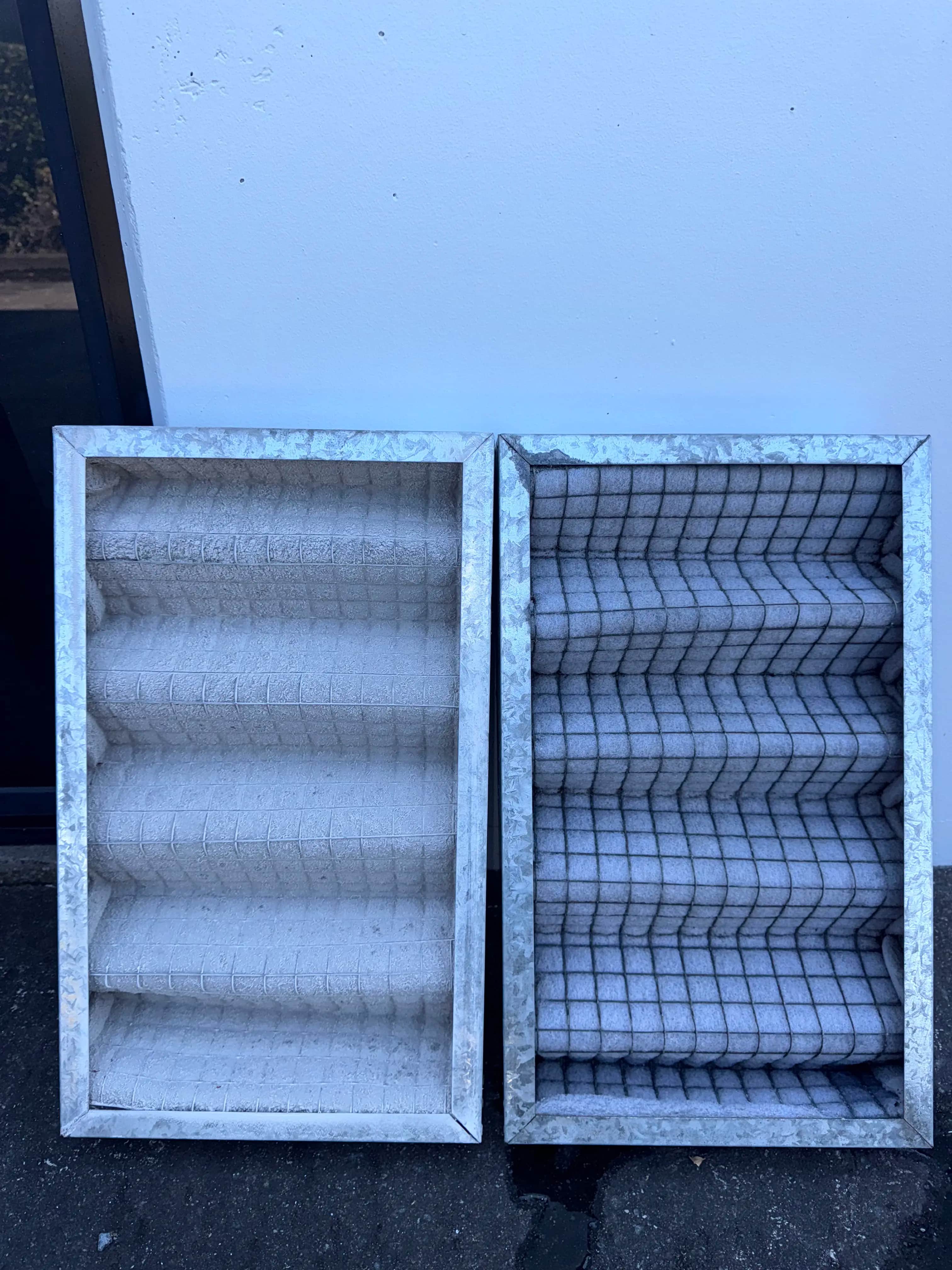 Dirty vs clean commercial pleated air filters side by side
